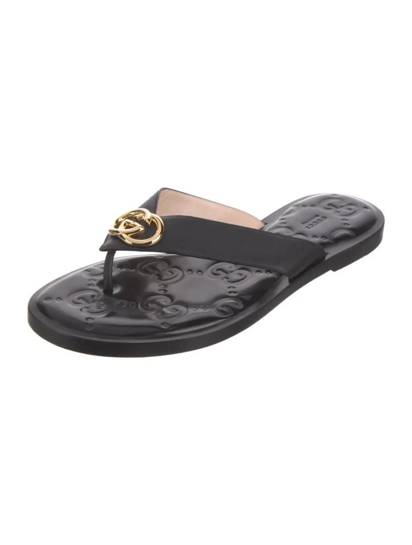 Gucci black leather gold logo sandals